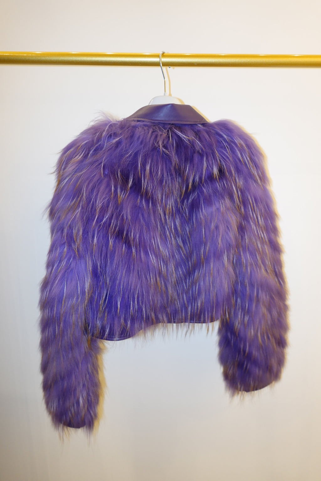 Purple fur jacket on a white background