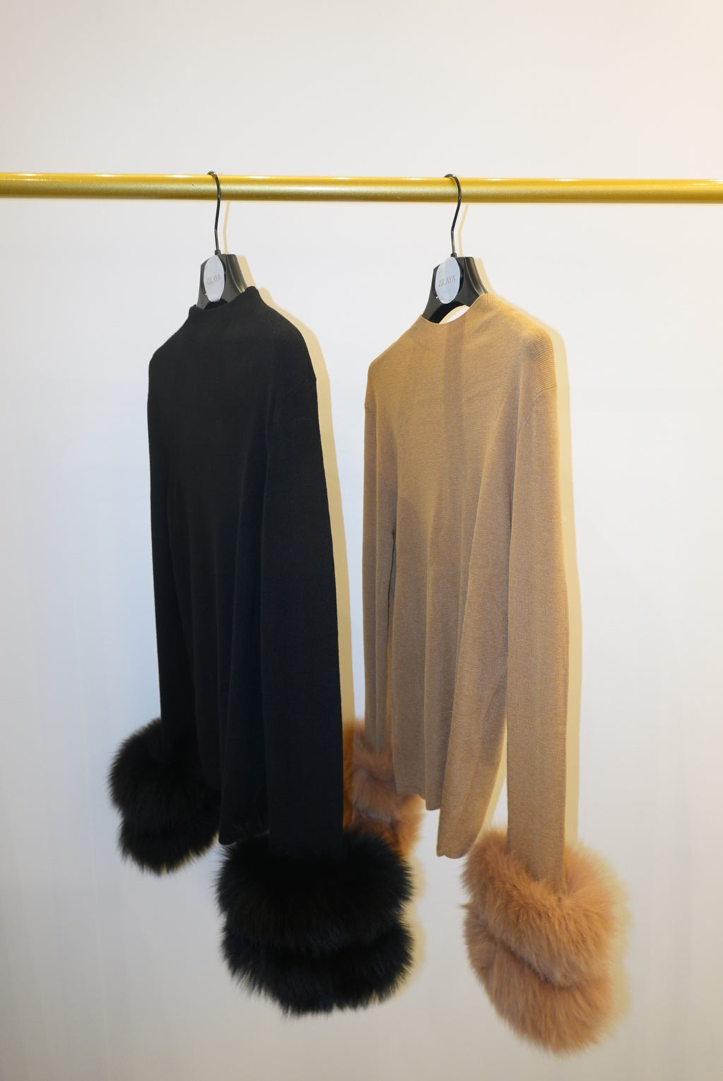 Two tops with detachable fur cuffs