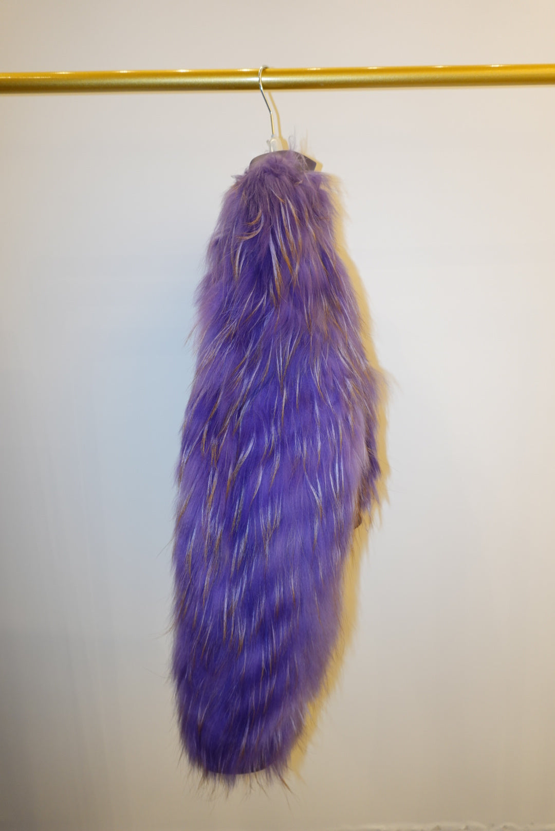 Purple fur jacket on a white background