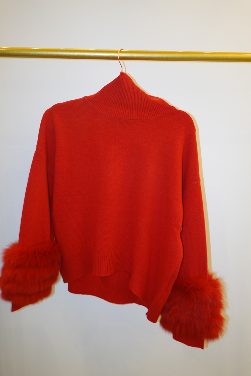 Red turtleneck with detachable fox fur cuff